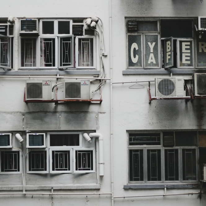 white window-type air conditioner on wall