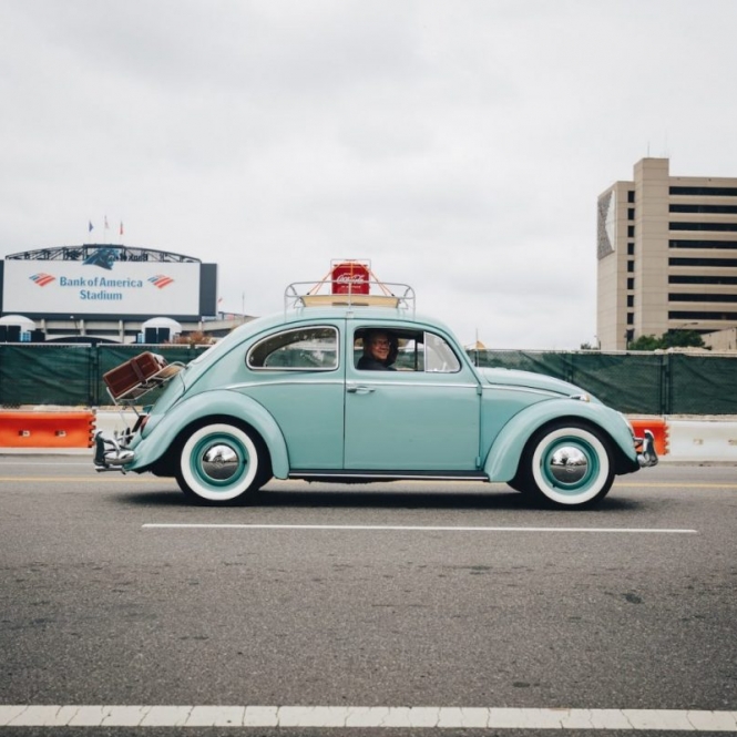teal Volkswagen Beetle car on road