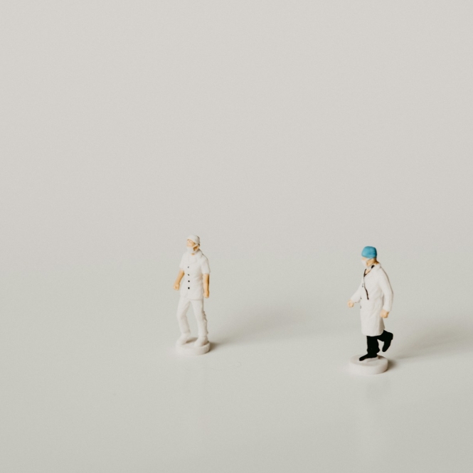 man in white dress shirt and black pants