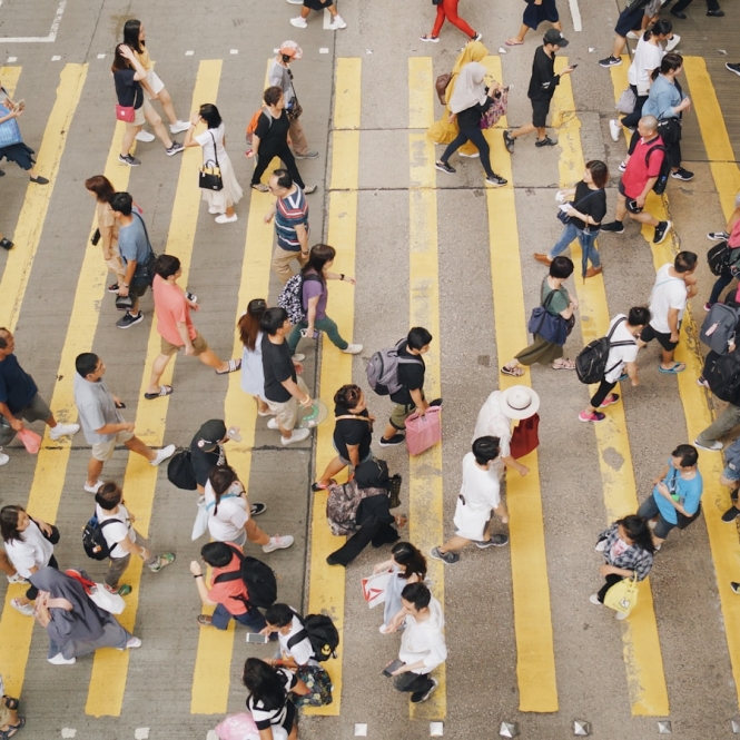 aerial photography of people walking on road during daytime