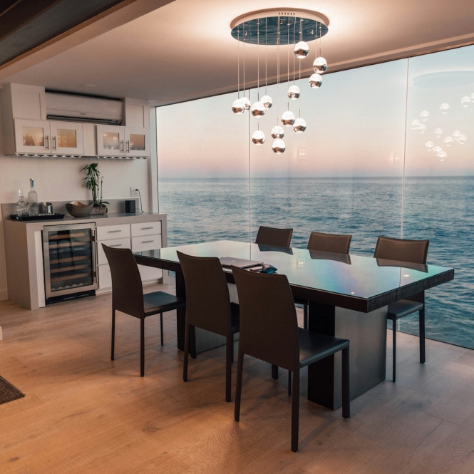 dining table set placed beside glass window