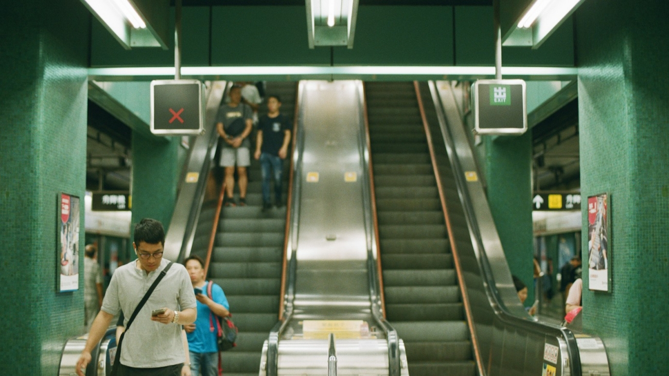 people near escalator