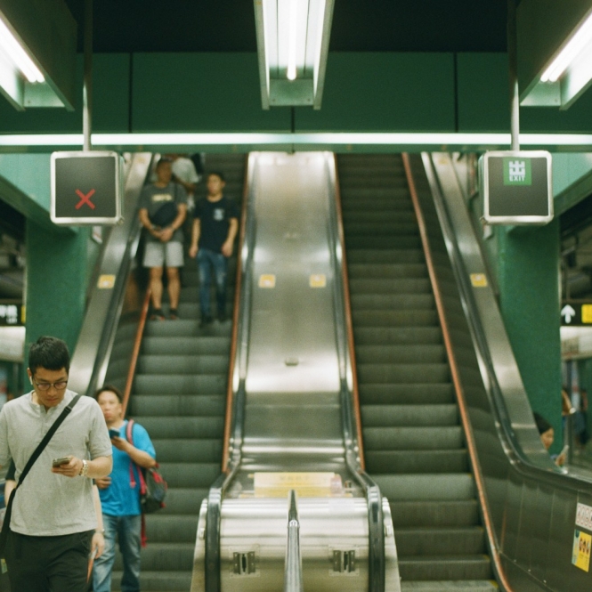 people near escalator