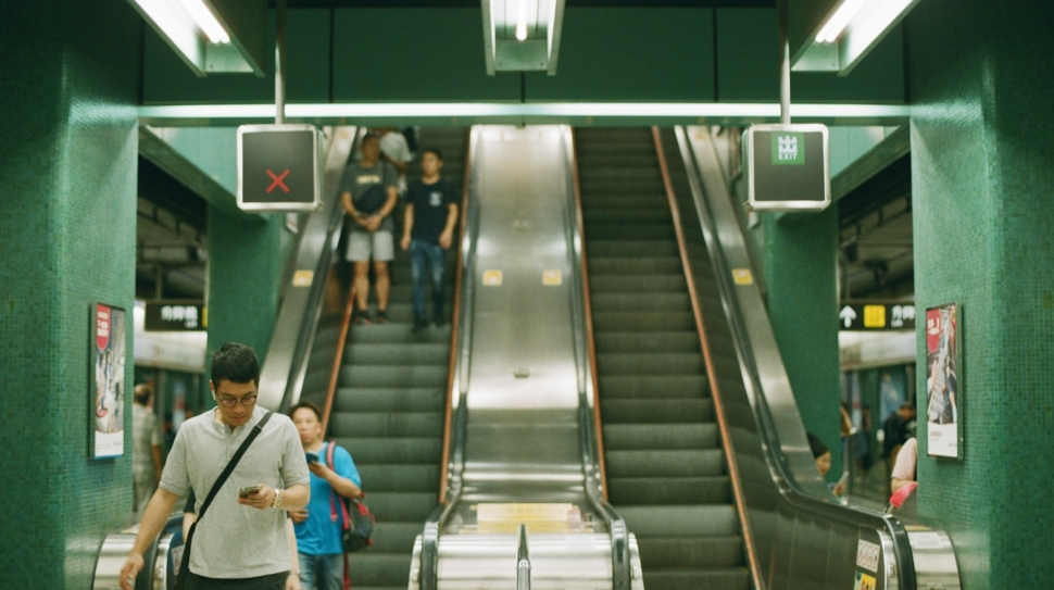 people near escalator