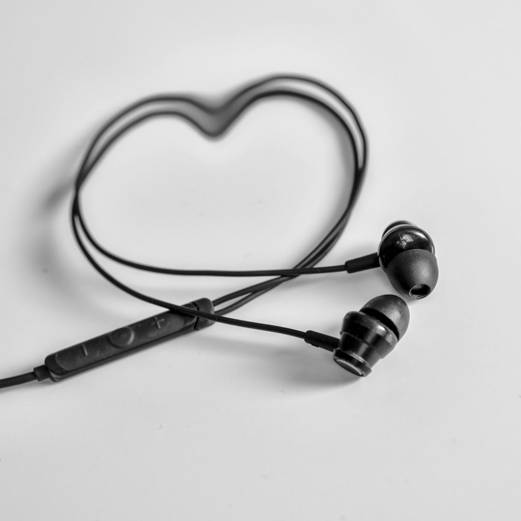 a pair of ear buds sitting on top of a table