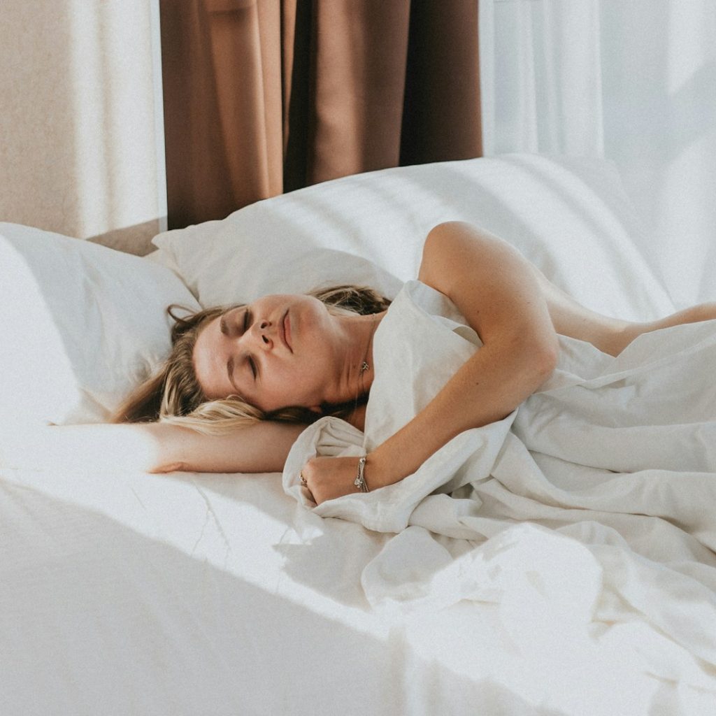 a person lying in a bed