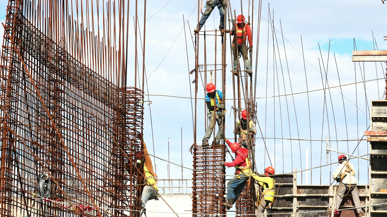 people working on building during daytime
