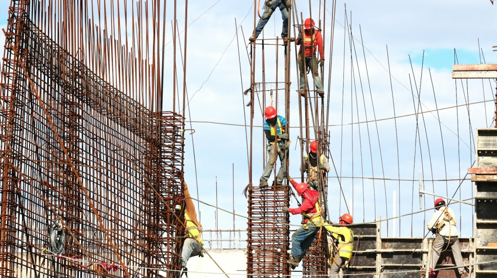 people working on building during daytime