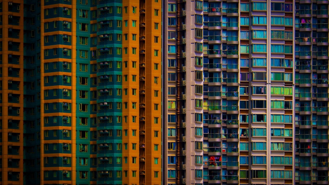 a row of multicolored buildings in a city