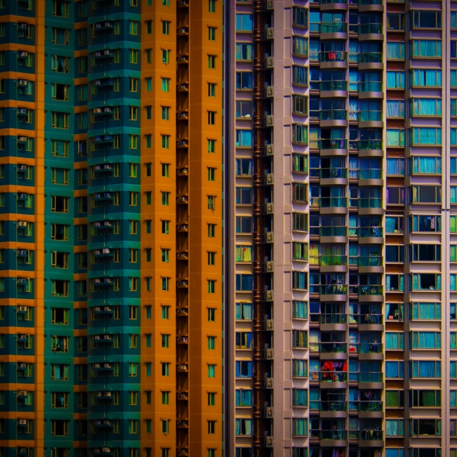 a row of multicolored buildings in a city