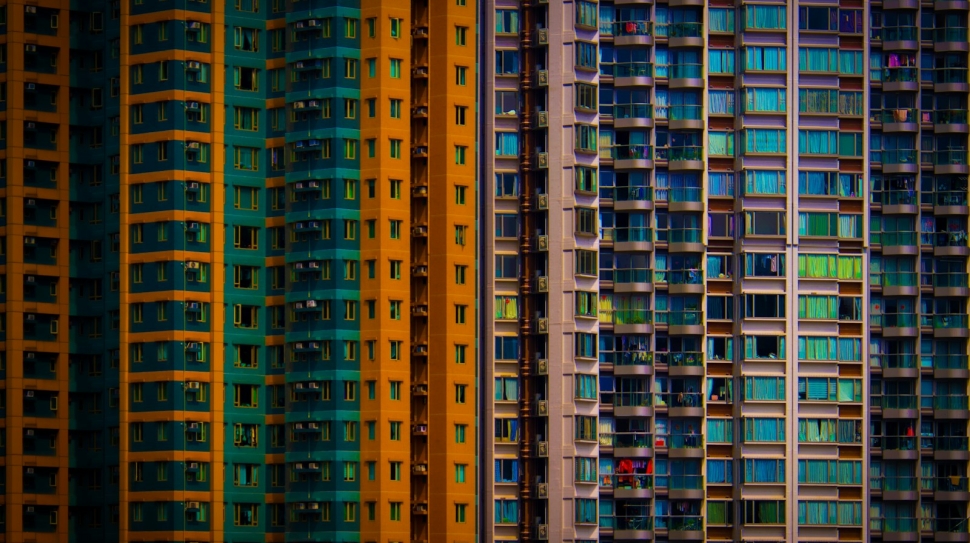 a row of multicolored buildings in a city