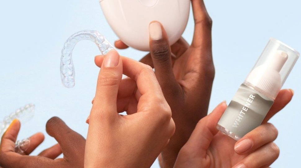 a group of people holding a white object in their hands