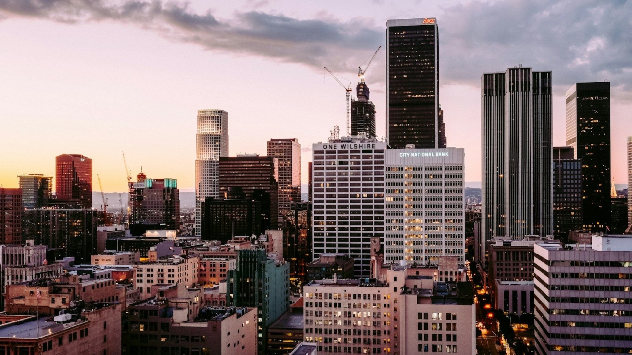 The One Wilshire building and surrounding skyscrapers in the Los Angeles skyline at dusk